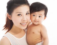 27868048 - happy  mother holding smiling child baby