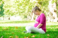 47378703 - happy and young pregnant woman in park in summer