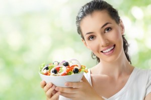 15187984 - a beautiful girl eating healthy food