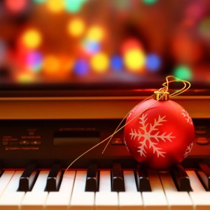 Christmas ball on piano keys