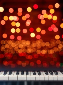 Piano keyboard front view on lights bokeh background