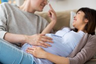 close up of man and pregnant woman